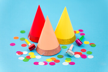 Image showing birthday party caps, horns and colorful confetti