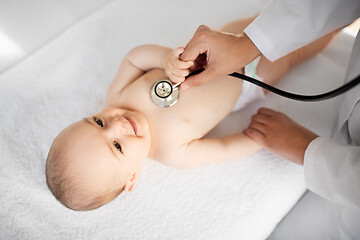 Image showing doctor with stethoscope listening to baby patient