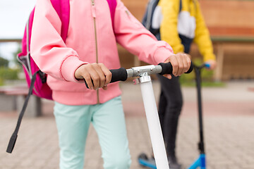 Image showing close up of school children with scooters