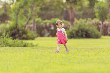 Image showing little girl spending time at backyard