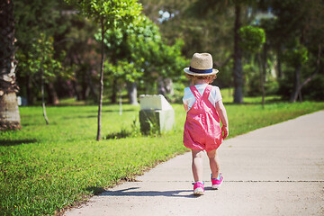 Image showing little girl runing in the summer Park