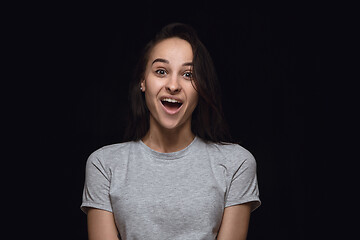 Image showing Close up portrait of young woman isolated on black studio background