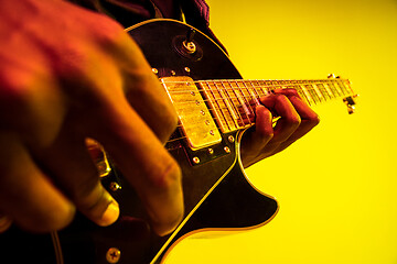 Image showing Young african-american jazz musician playing the guitar