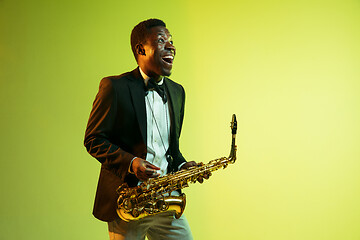 Image showing Young african-american jazz musician playing the saxophone