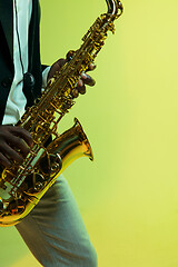 Image showing Young african-american jazz musician playing the saxophone