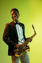 Image showing Young african-american jazz musician playing the saxophone