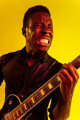 Image showing Young african-american jazz musician playing the guitar