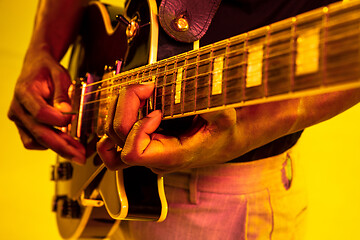 Image showing Young african-american jazz musician playing the guitar