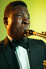 Image showing Young african-american jazz musician playing the saxophone