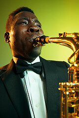 Image showing Young african-american jazz musician playing the saxophone