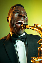 Image showing Young african-american jazz musician playing the saxophone