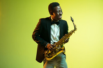 Image showing Young african-american jazz musician playing the saxophone