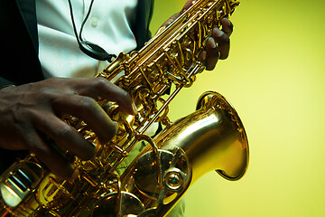 Image showing Young african-american jazz musician playing the saxophone