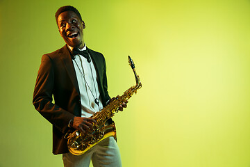 Image showing Young african-american jazz musician playing the saxophone