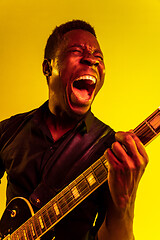 Image showing Young african-american jazz musician playing the guitar