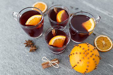 Image showing glasses of mulled wine with orange and cinnamon