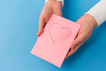 Image showing hands holding greeting card with heart