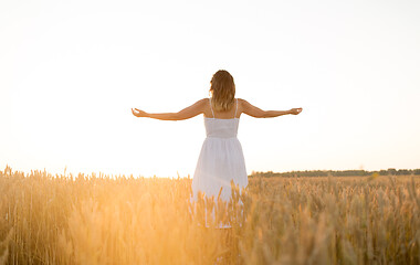 Image showing happy woman enjoying freedom on cereal field