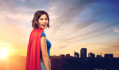 Image showing happy woman in superhero cape over tallinn city