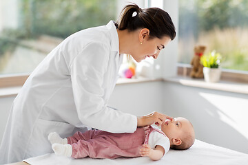 Image showing female pediatrician doctor with baby at clinic