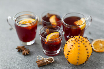 Image showing glasses of mulled wine with orange and cinnamon