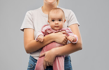 Image showing happy young mother holding little baby daughter