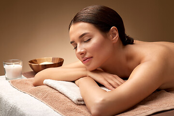 Image showing young woman lying at spa or massage parlor