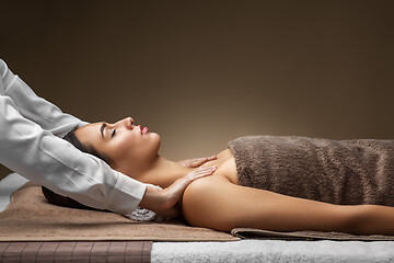 Image showing woman having face and head massage at spa