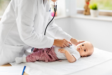 Image showing doctor with stethoscope listening to baby patient