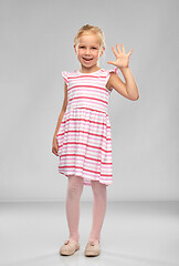 Image showing smiling little girl in striped dress