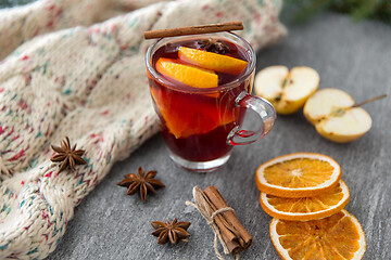 Image showing glass of hot mulled wine with orange and cinnamon