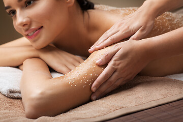 Image showing close up of woman having salt massage at spa