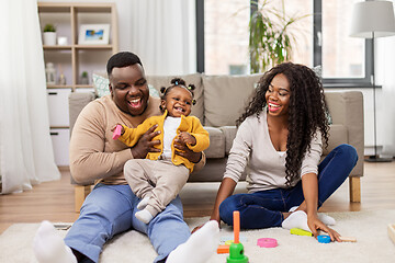 Image showing african family playing with baby daughter at home