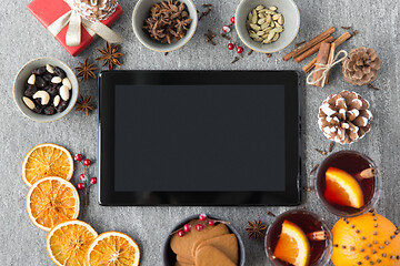 Image showing tablet computer, mulled wine and christmas stuff