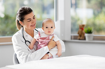 Image showing female pediatrician doctor with baby at clinic