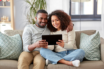 Image showing african american couple with tablet pc at home