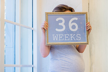 Image showing 36 weeks of pregnancy sign in woman hands