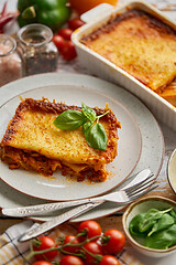 Image showing Delicious lasagne bolognese with pepper, tomato and cheese