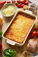 Image showing Tasty traditional italian lasagna with bolognese, melted and cheese. Served with ingredients