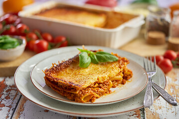 Image showing Delicious lasagne bolognese with pepper, tomato and cheese