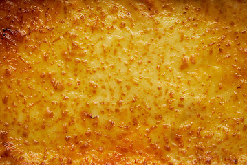 Image showing Background texture of melted mozzarella cheese on a lasagne or pizza base