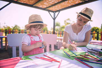 Image showing mom and little daughter drawing a colorful pictures