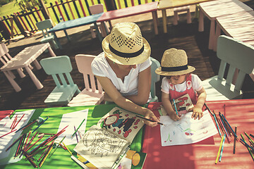 Image showing mom and little daughter drawing a colorful pictures