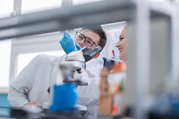 Image showing Group of young medical students doing research