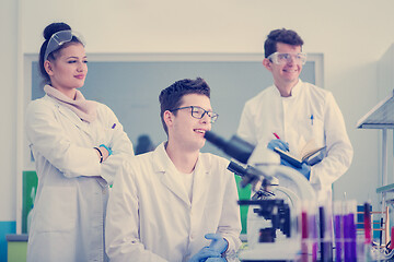 Image showing Group of young medical students doing research