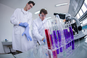 Image showing Group of young medical students doing research