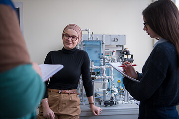 Image showing young students doing practice in the electronic classroom