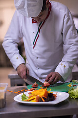 Image showing chef serving vegetable salad