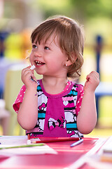 Image showing little girl drawing a colorful pictures