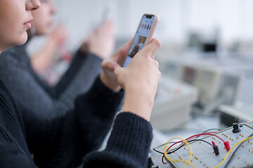 Image showing female student using a mobile phone